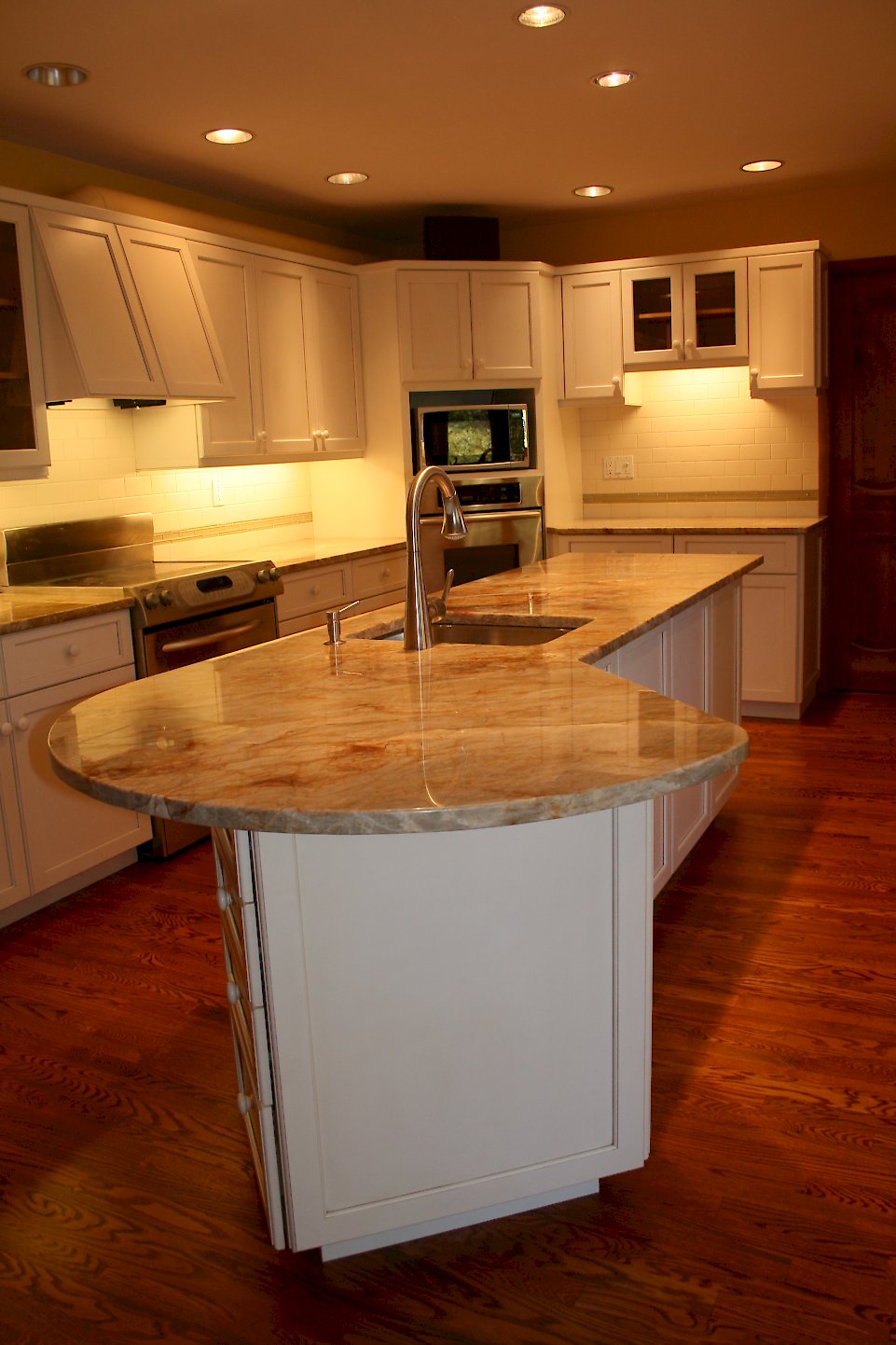 Rounded counter-top at the end of the island.