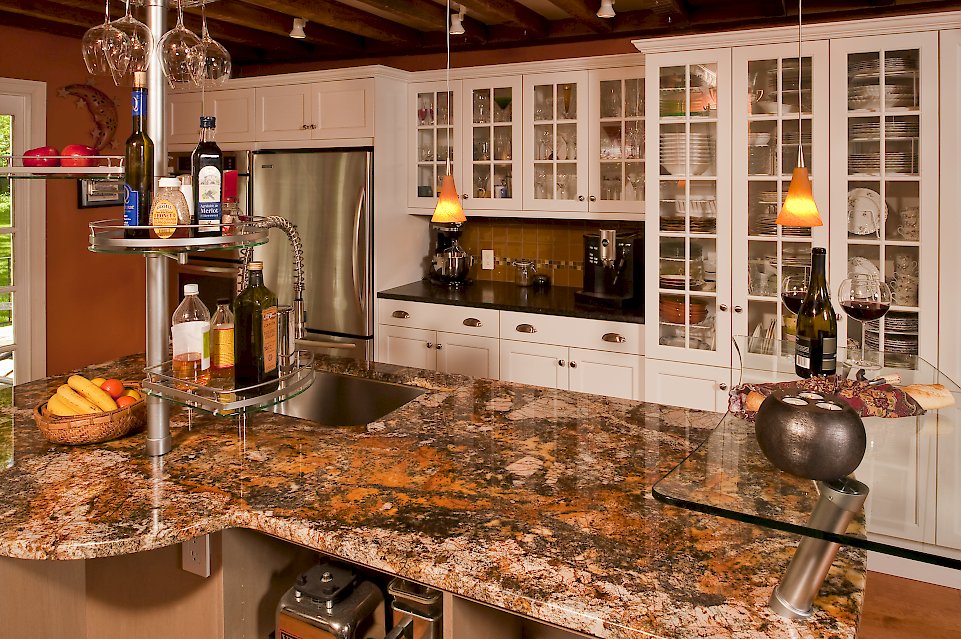 Glass door cabinetry for wine glasses and dishs.