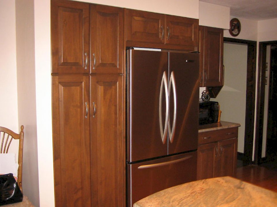 View of the stainless refrigerator and pantry.