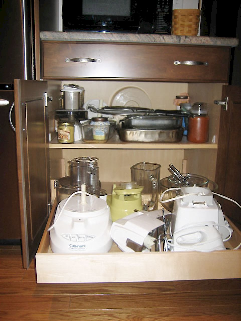 Pull out drawer underneath a standard shelf.