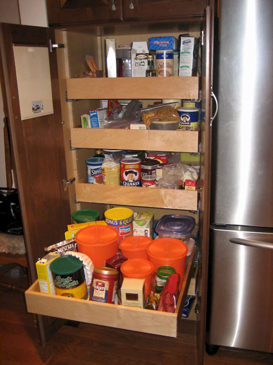 Pull out drawers in the pantry unit for extra storage.