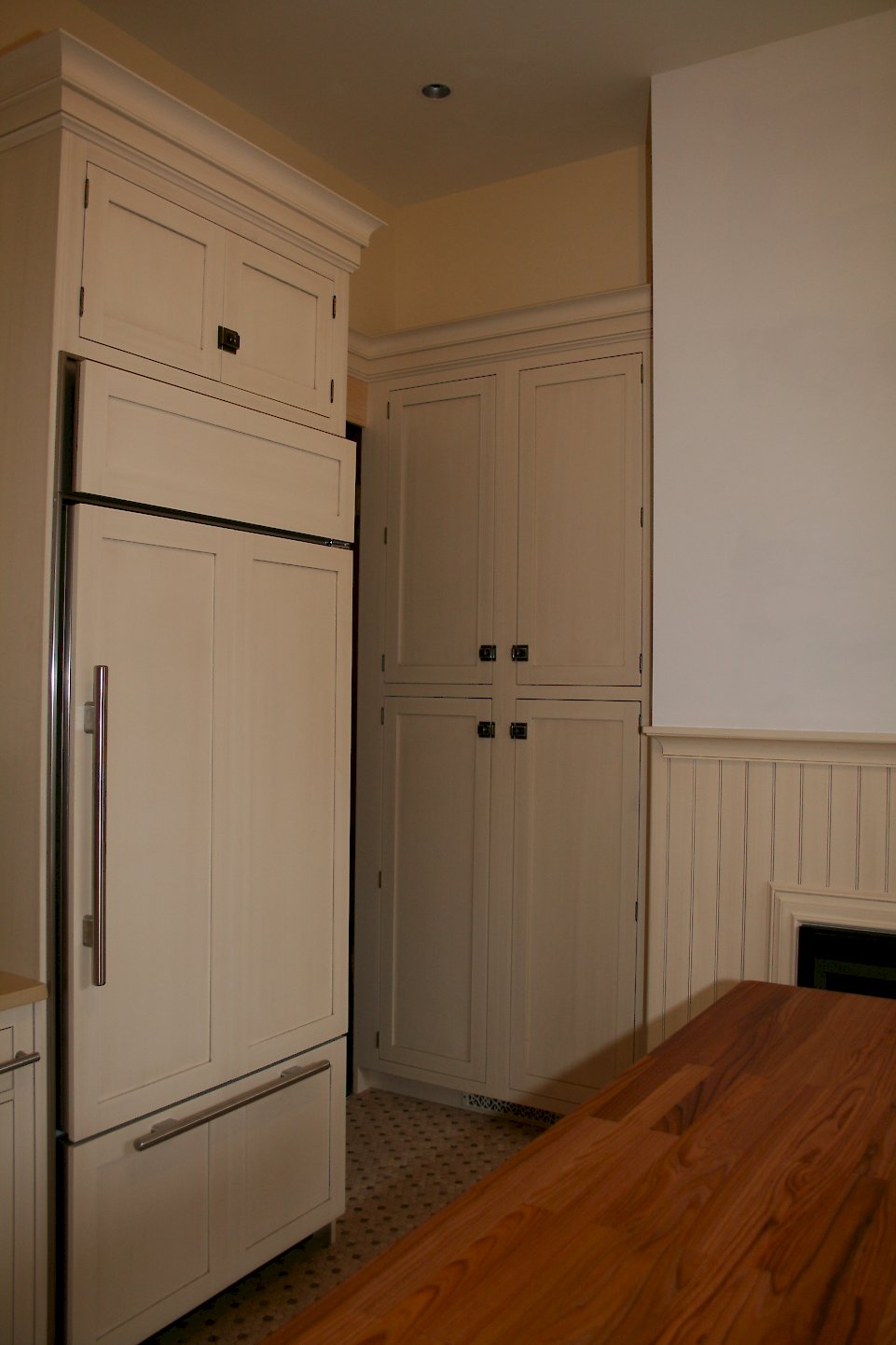 Tall pantry unit built into the wall.