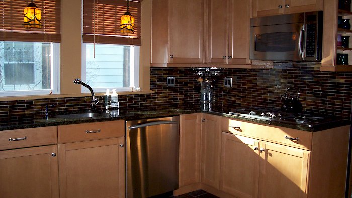 A Carmel Maple kitchen with an Uba Tuba granite Counter-top.