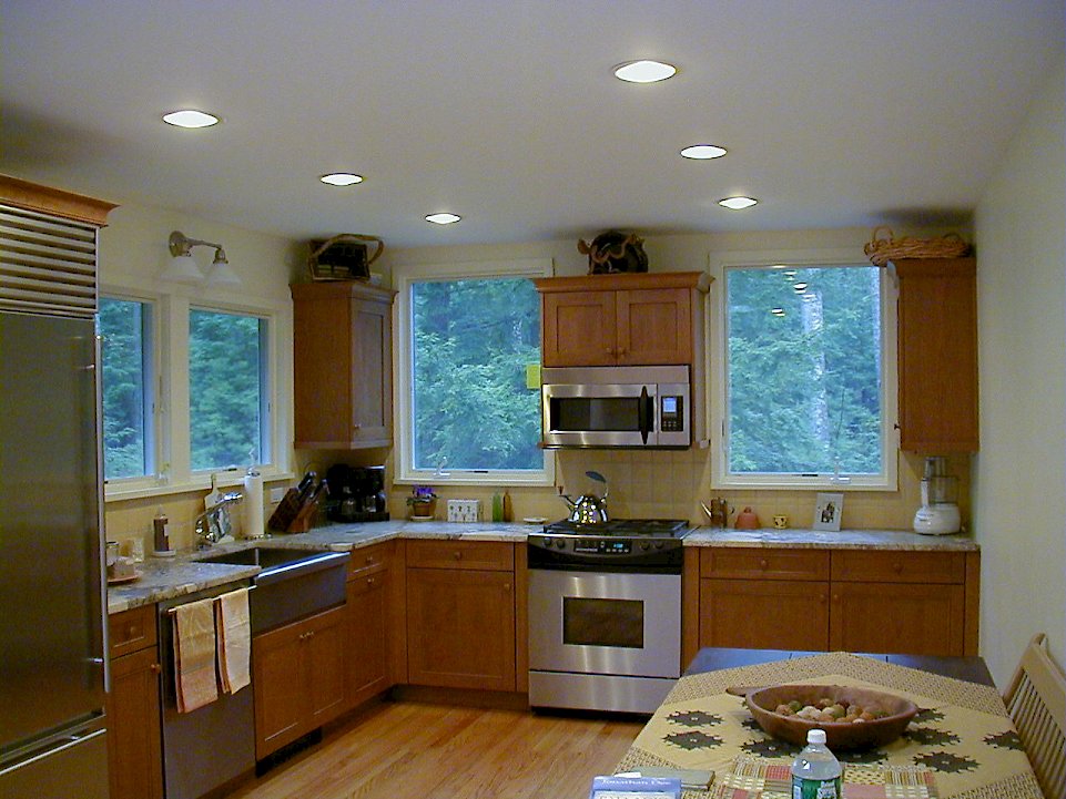 Cherry Wood-Mode kitchen with honed jupara persia granite counter-tops.