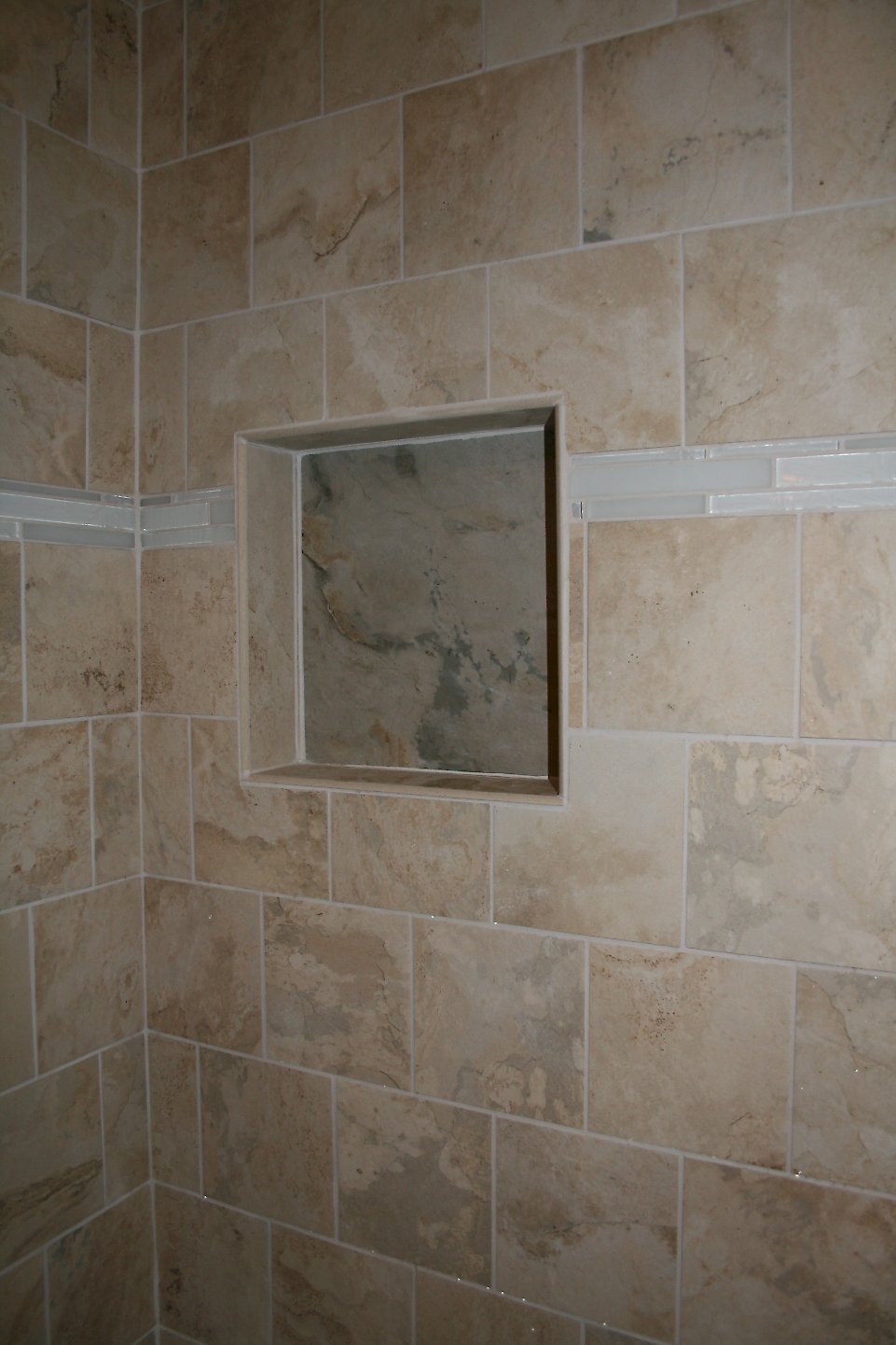 Recessed shelf in the shower wall.