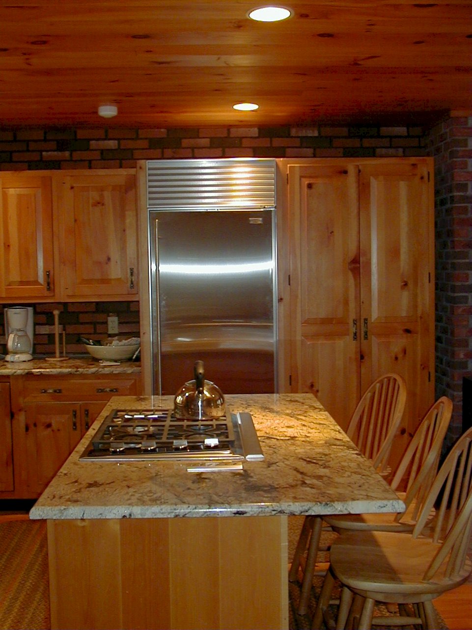 A stainless steel Sub-Zero 611 Refrigerator and Wolf CT306S-LP cooktop.