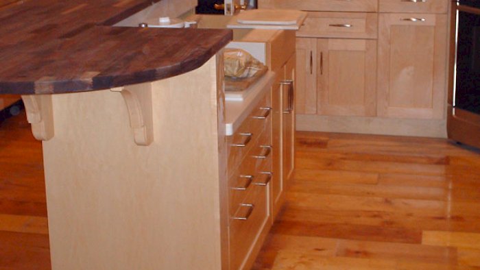 Black walnut butcher block counter on the island.