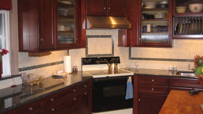 A maple cordovan brookhaven kitchen with the Pelhem Manor door style.