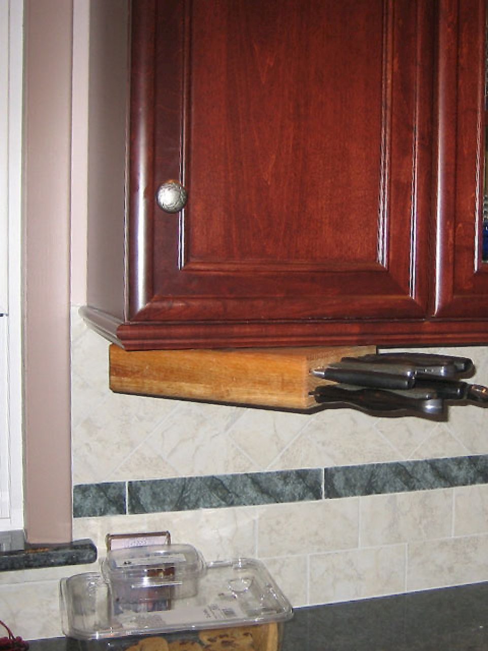 Under cabinet knife storage.