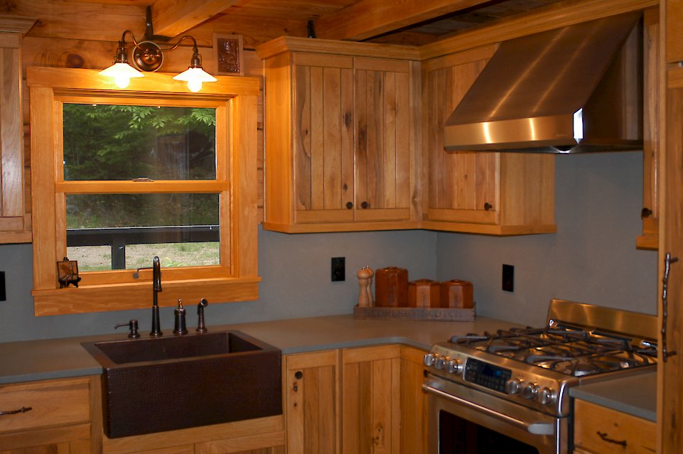 A Medallion Designer Gold hickory kitchen with a custom finish.