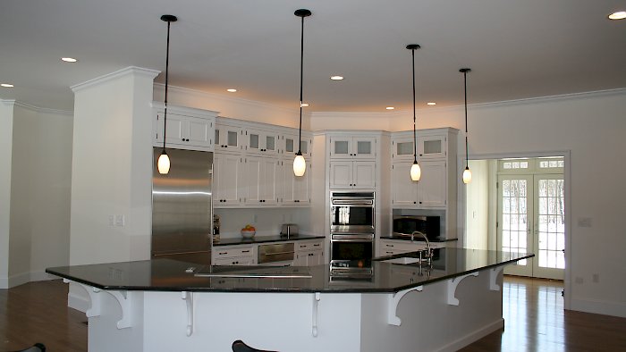 Wood-Mode inset kitchen Nordic White on Oak wood.