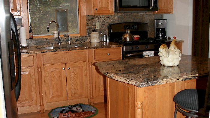 Honey Oak Kitchen with full height back-splash.