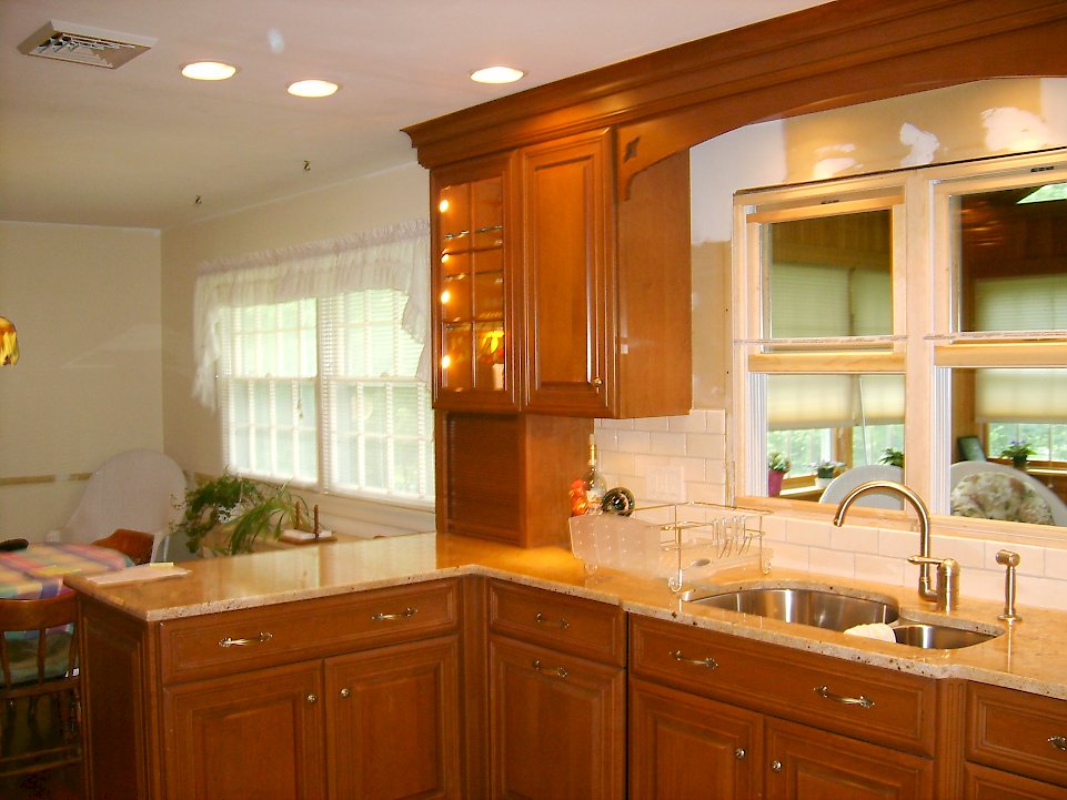 Glass wall cabinet with internal lighting.