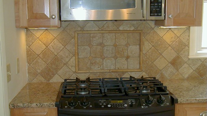 Closer view of the custom tiled backsplash.