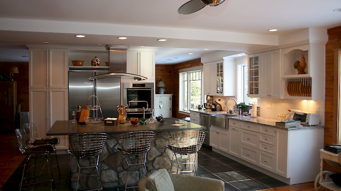 A Nordic White Kitchen With a large island.