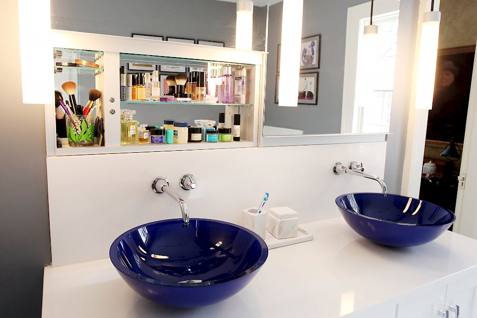 Cobalt blue transparent vessel sinks on the vanity.