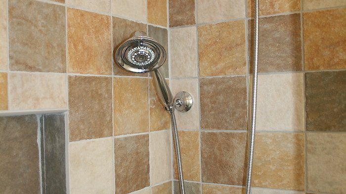 6x6 multicolored tile in the shower.